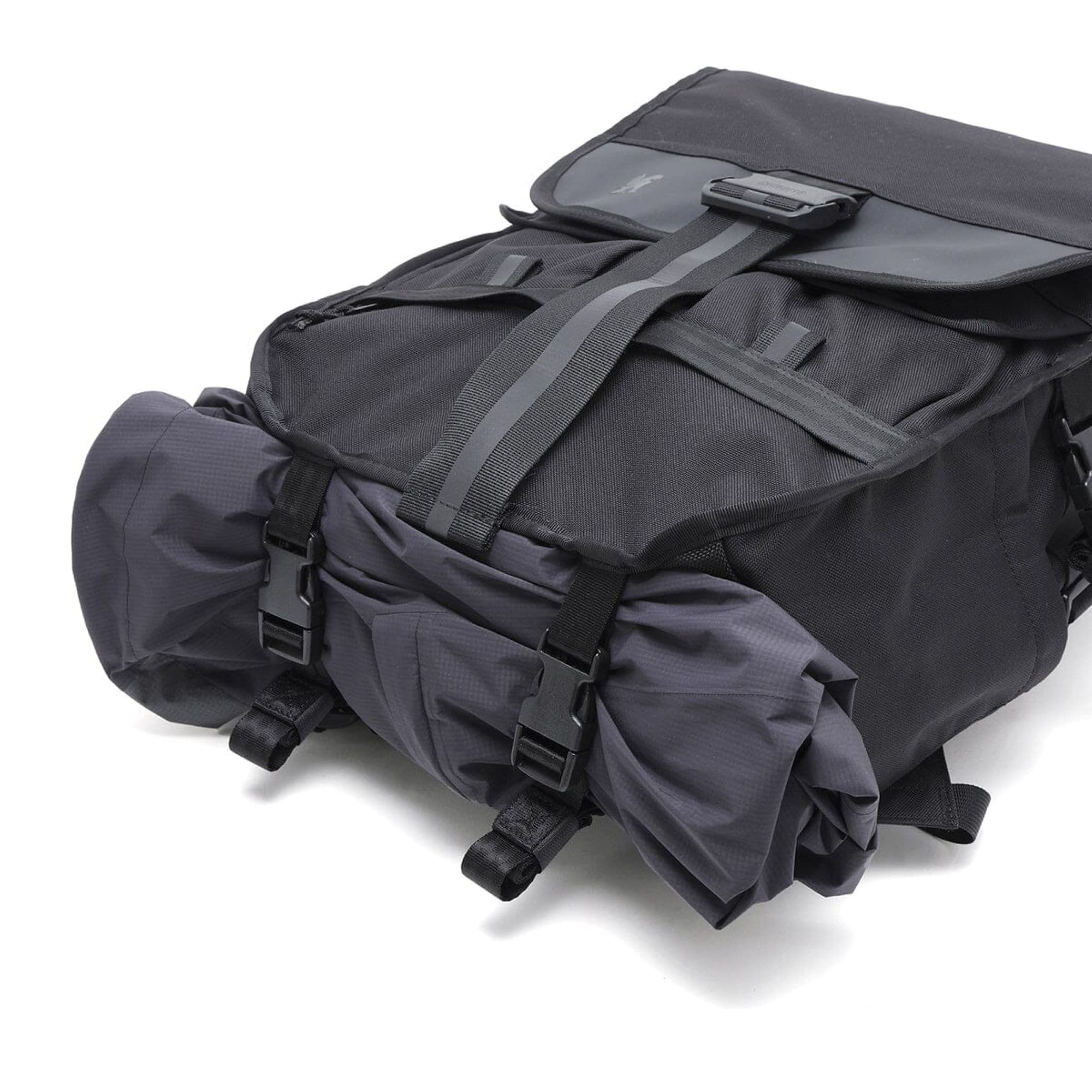 Warsaw backpack with a rolled up jacket on the bottom